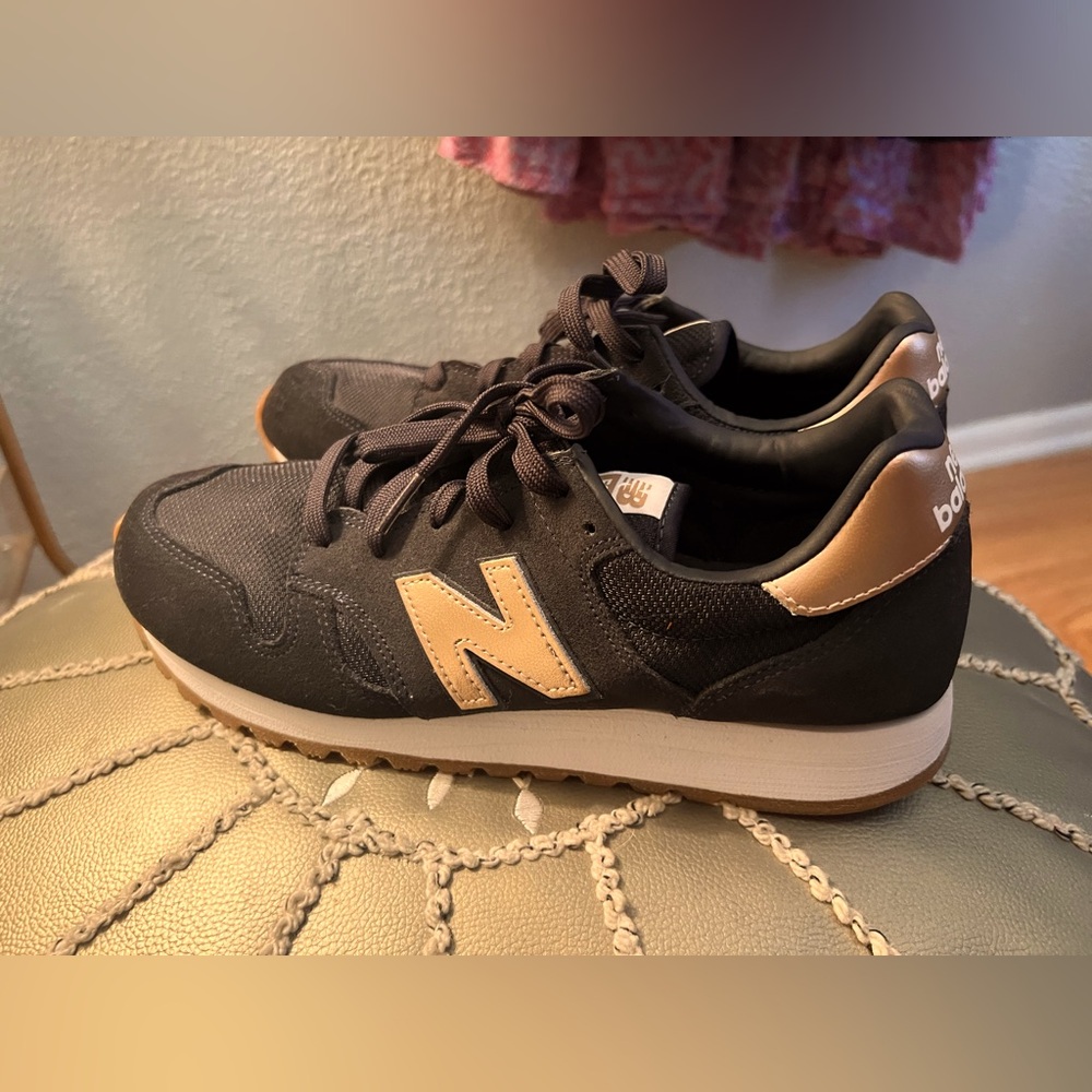 New Balance 574 sneakers, navy with rose gold, size 9.